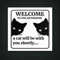 Welcome to the Bathroom a cat will be with you shortly